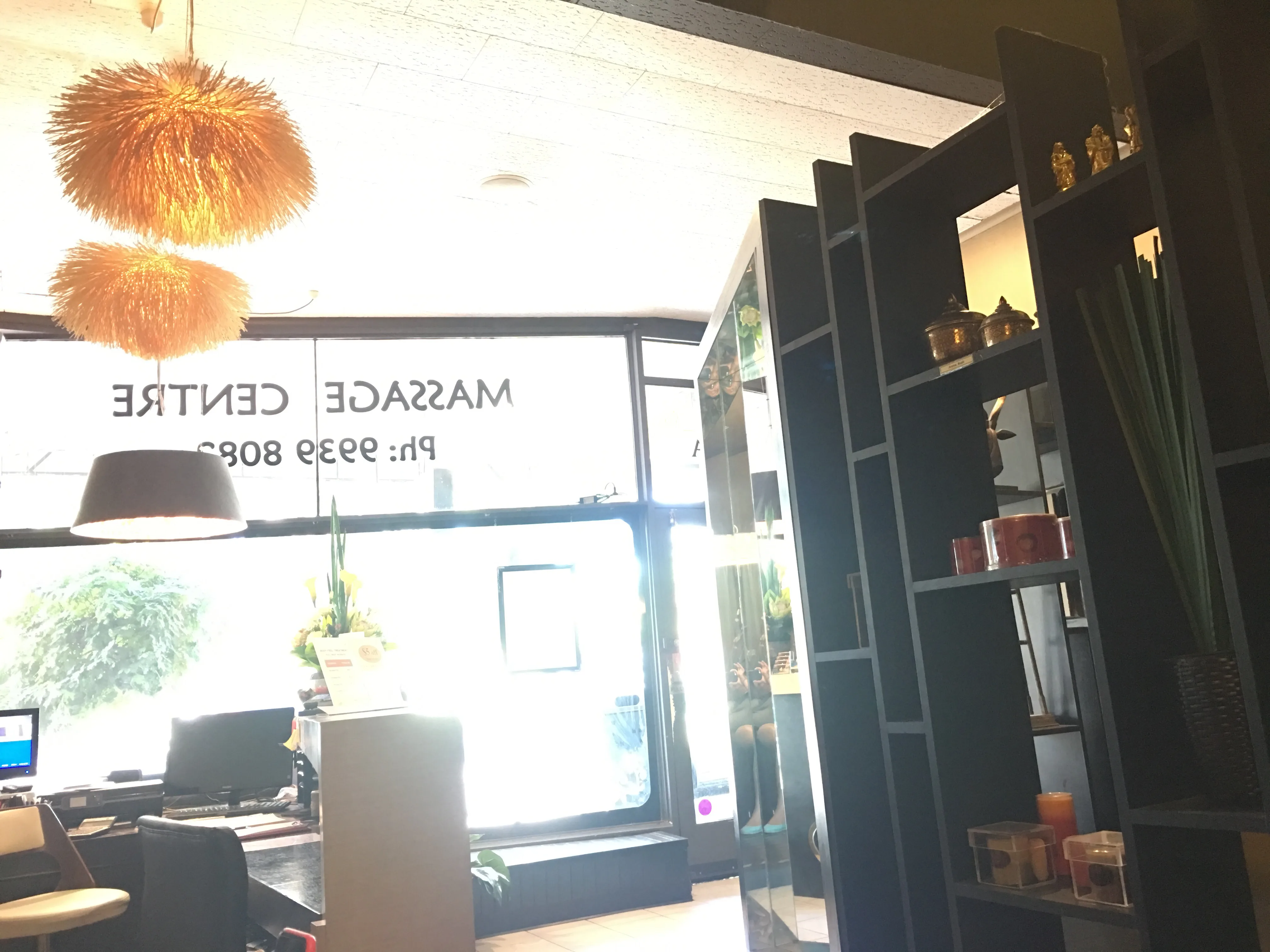 Reception interior with massage centre window decal