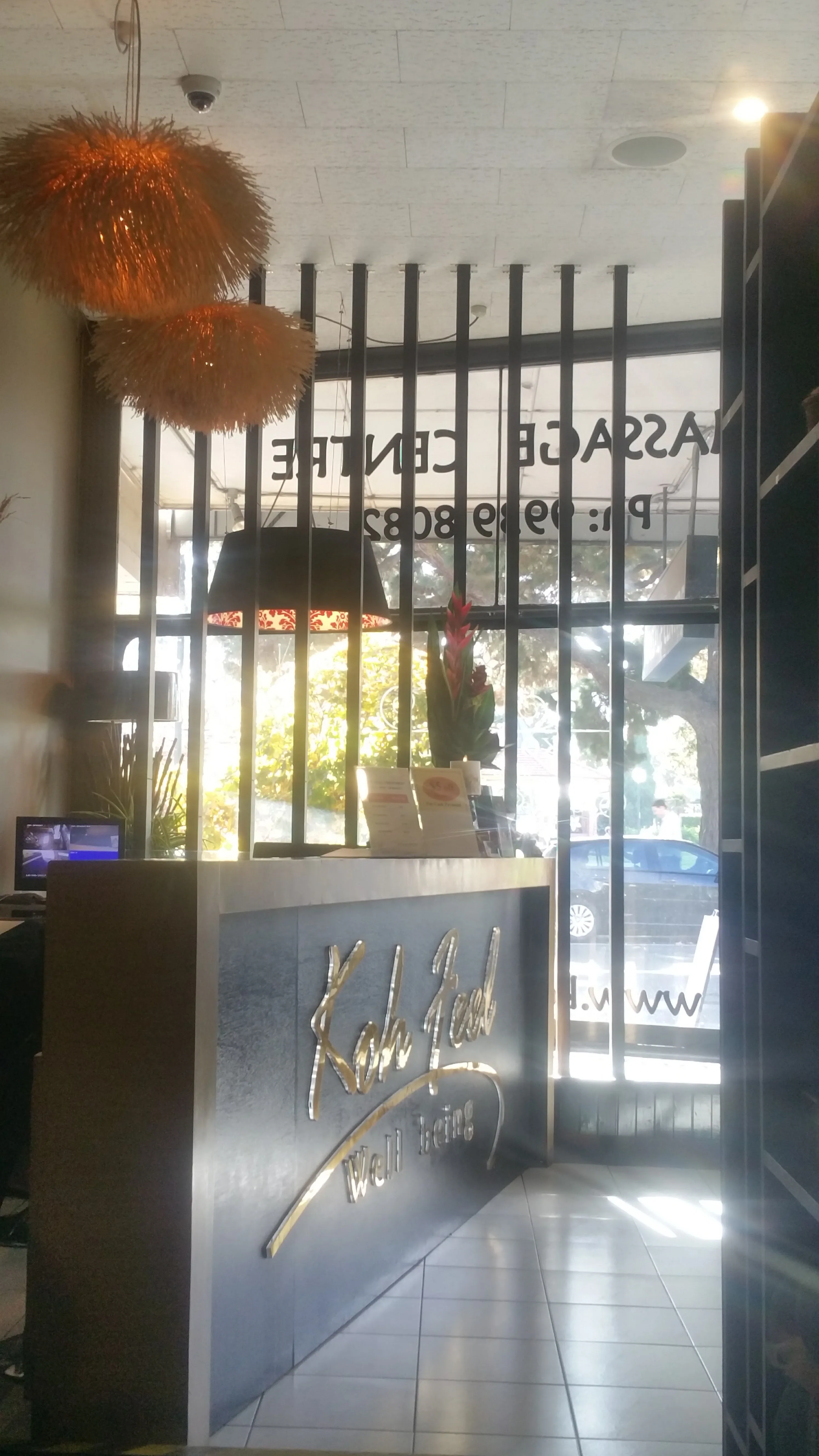 Reception desk and shopfront window with ginger flower arrangement