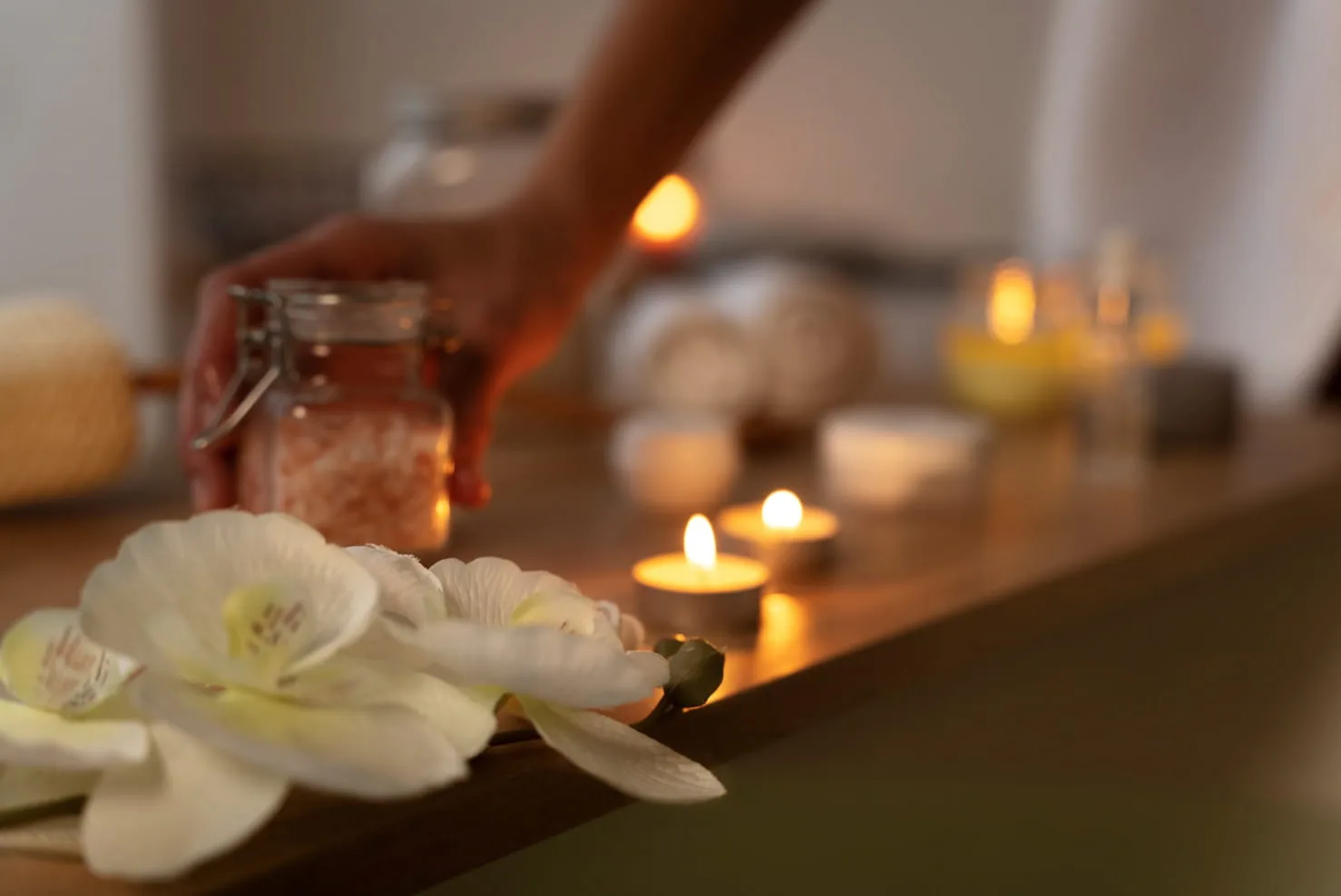 Spa detail — salt jar, tealight candles and orchids